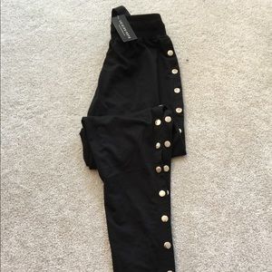 Jogger pants with snap on buttons on the side